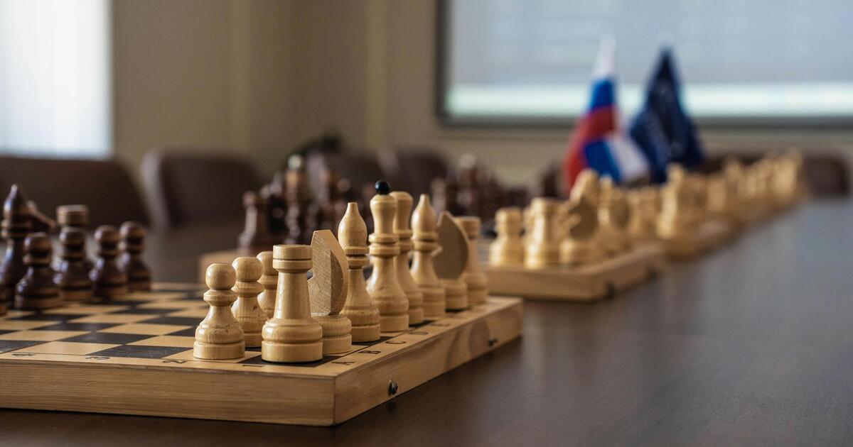 elegant-chess-board-setup-in-meeting-room-36038795.jpg
